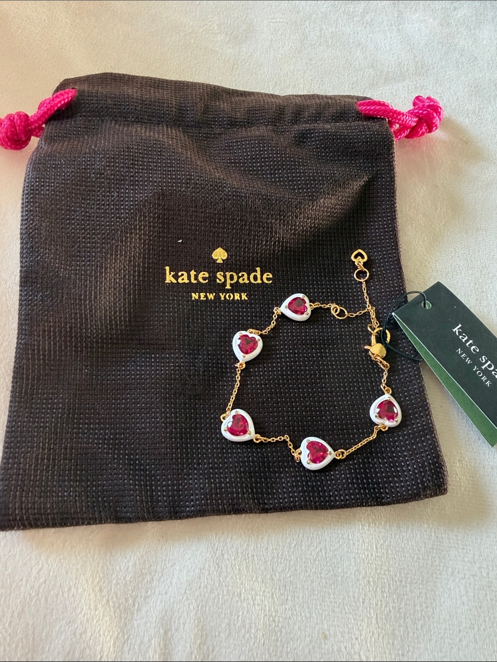 kate spade Gold-Tone Bracelet with Hot Pink & White Heart Charms